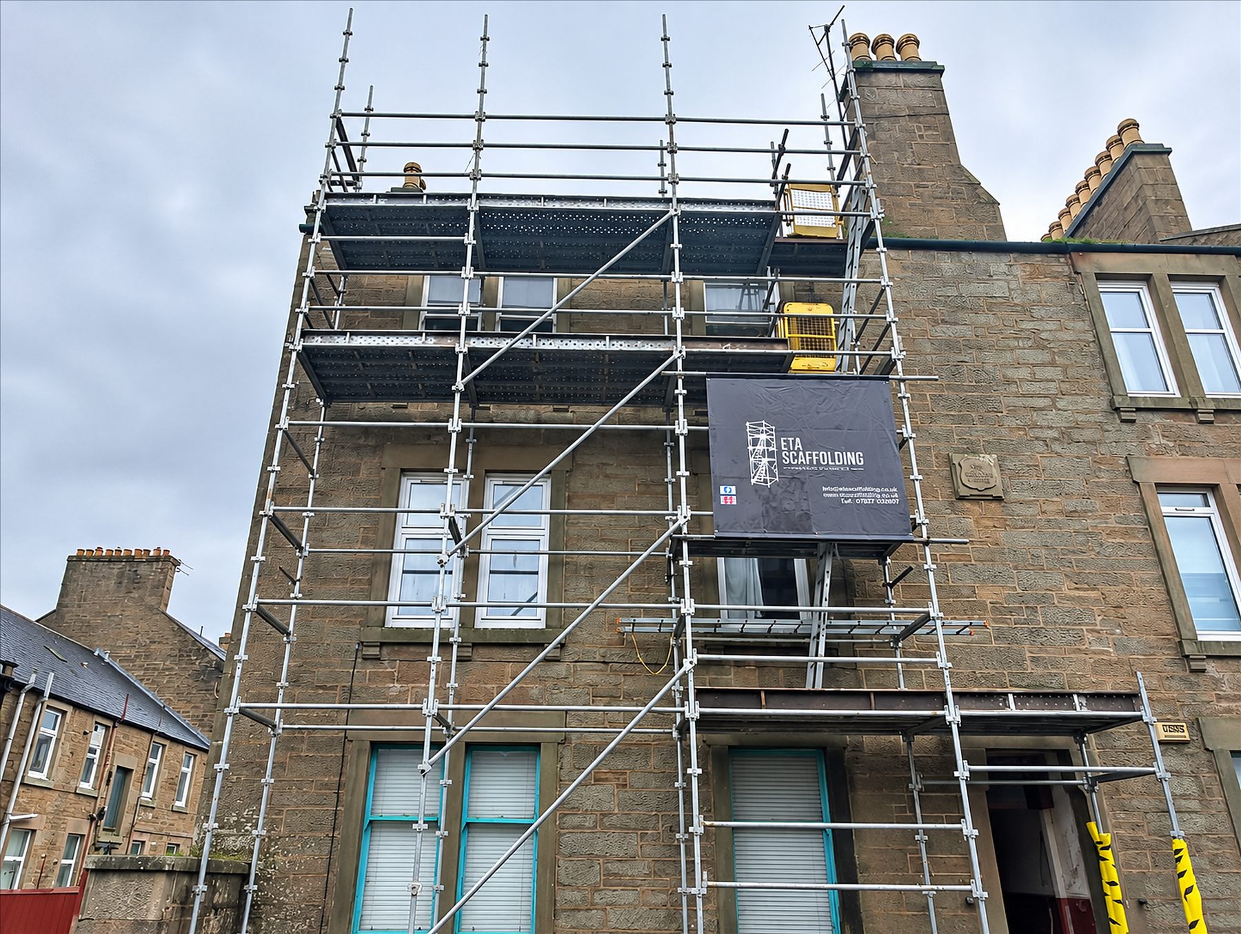ETA Scaffolding banner on a residential project