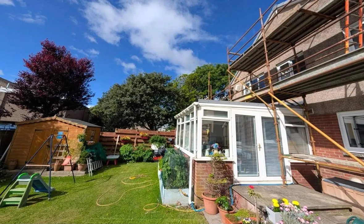 Scaffolding above a conservatory at a residential property