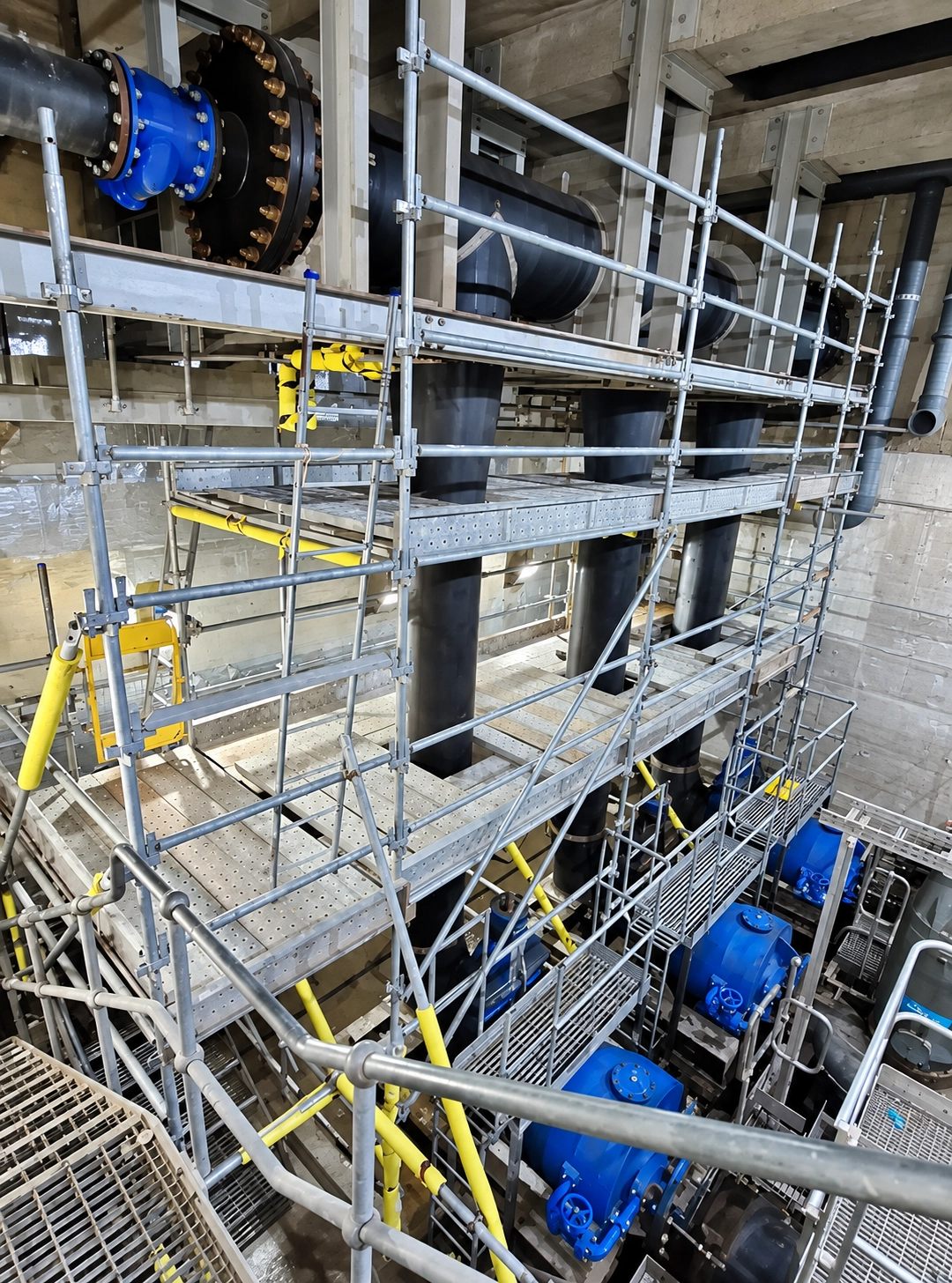 Industrial scaffolding installation around plant equipment