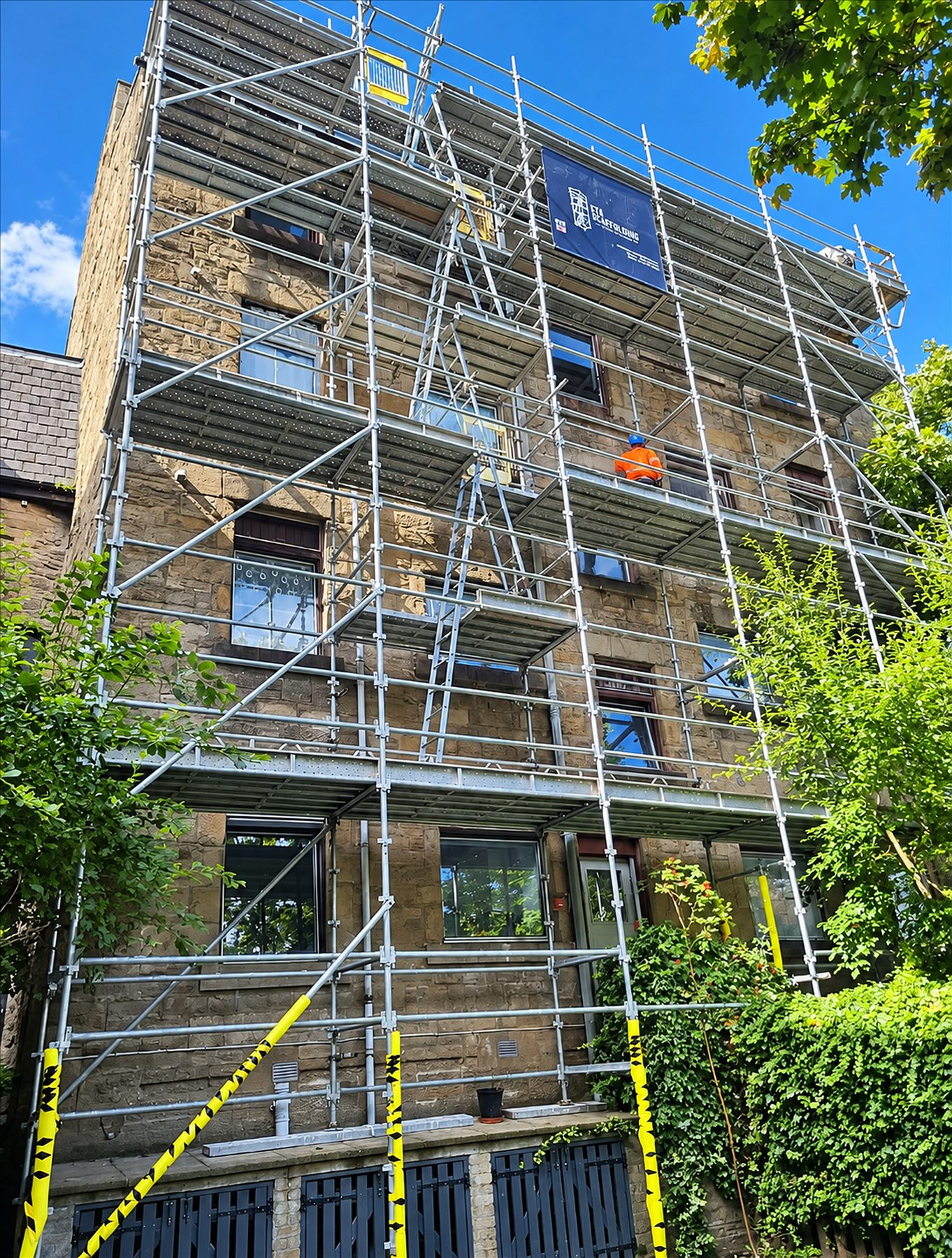 Multi-level scaffolding on a residential building